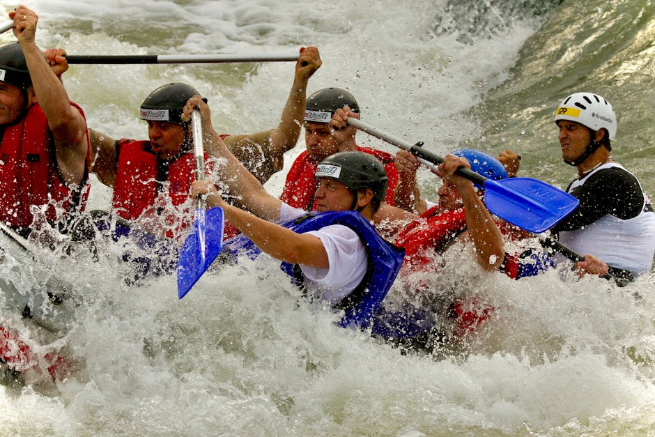 Exciting whitewater rafting adventure with sportsmen in helmets navigating rapids.